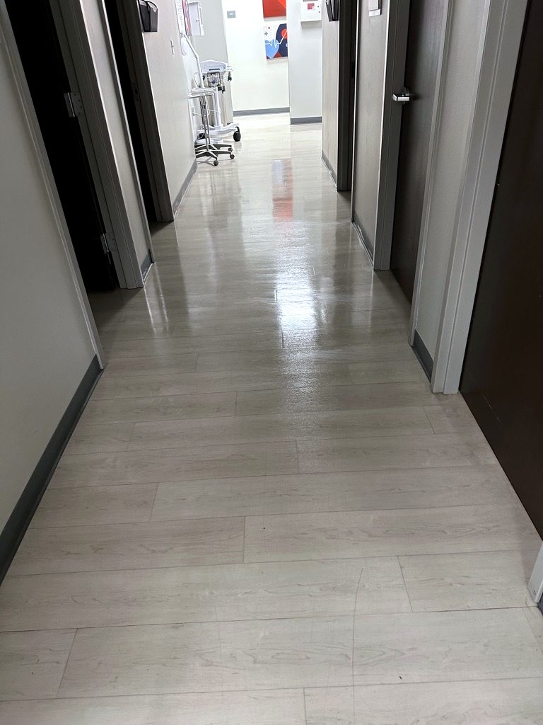Exam room hallway in a medical clinic in Munster, Indiana, with polished floors