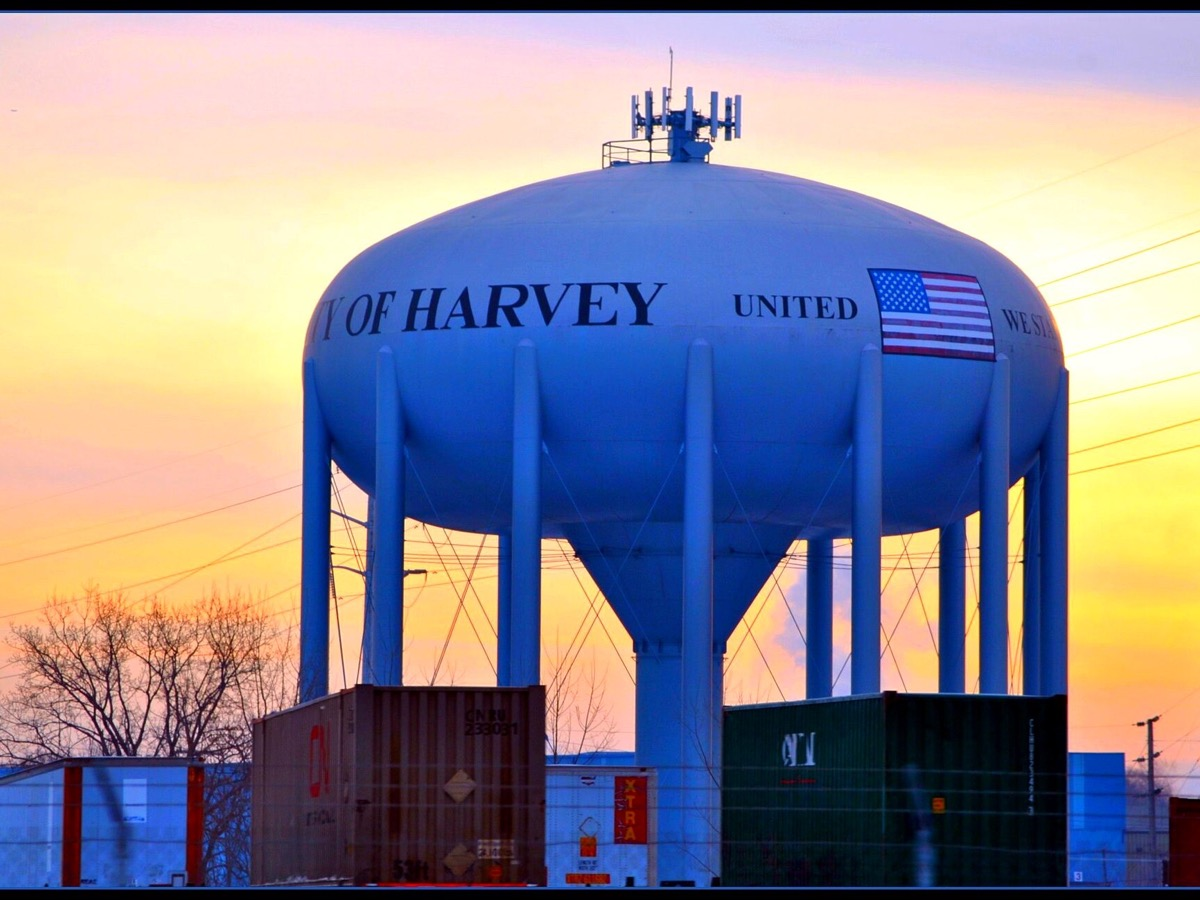The city water tower at sunset in Harvey, Illinois. Photo: Loco Steve, CC BY 3.0, via Wikimedia Commons.